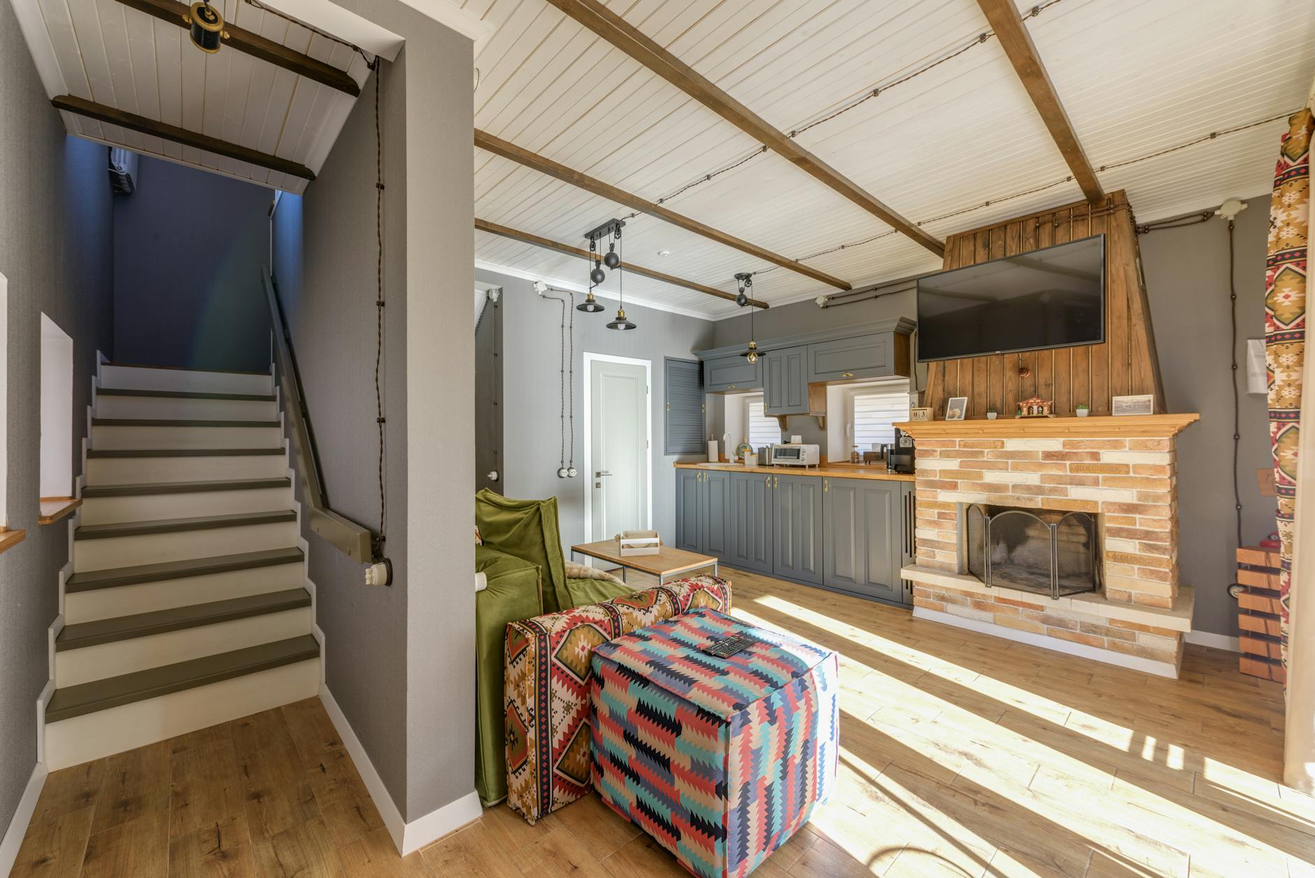 Modern split-level home built into a steep, landscaped hillside.