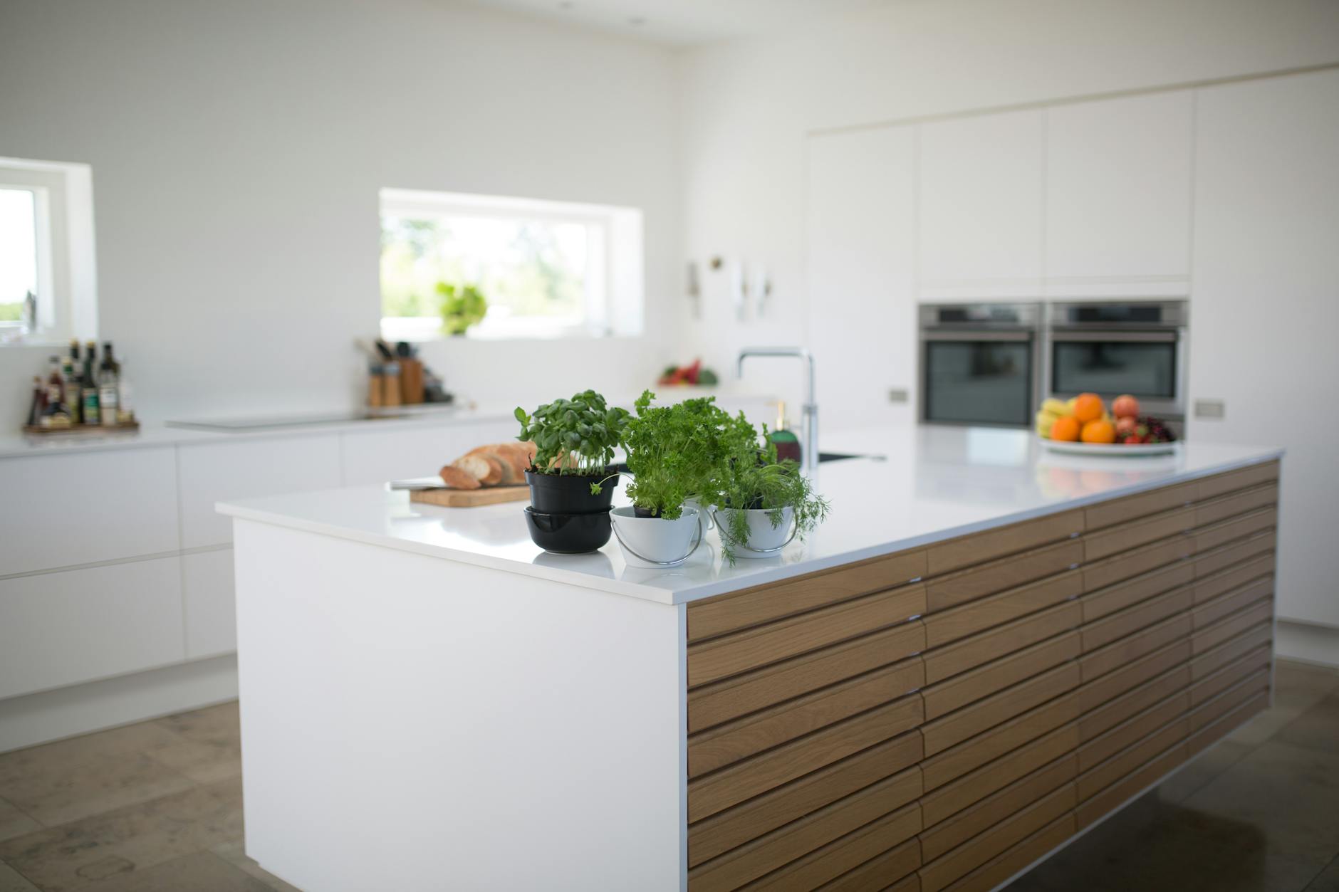 A modern galley kitchen with parallel countertops and cabinets.