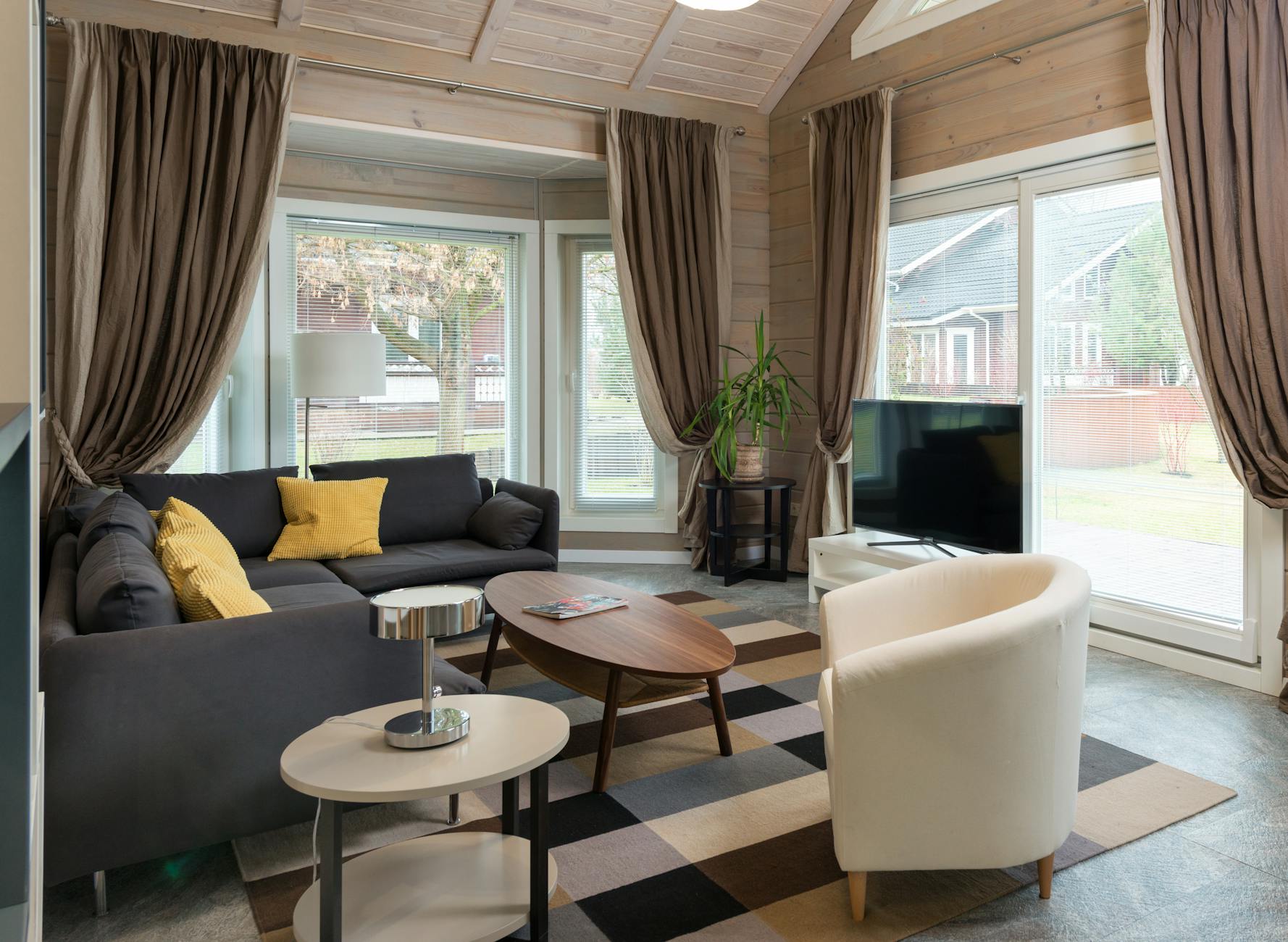 A modern architect's desk with a feng shui bagua map overlay.