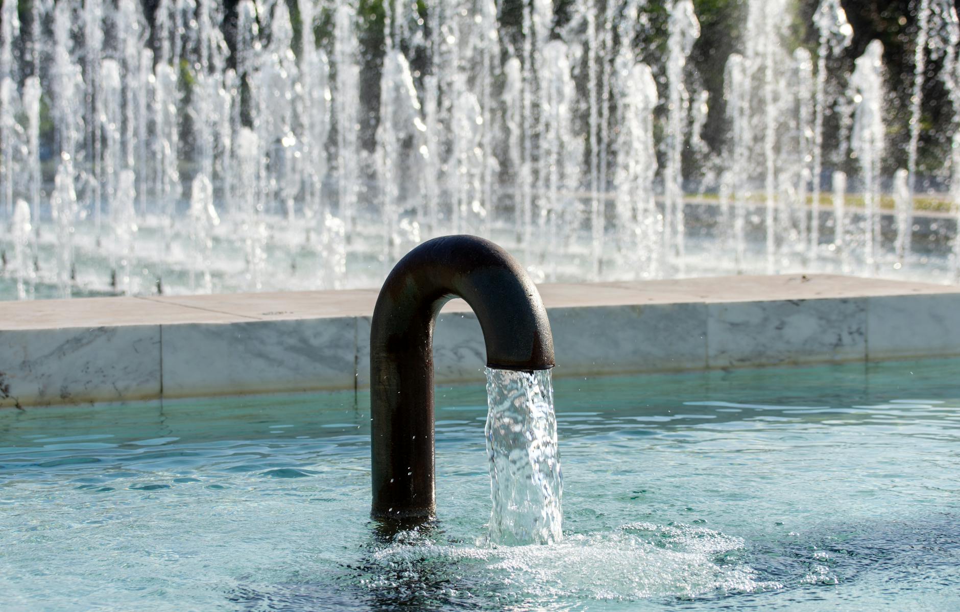 Feng Shui water features – indoor fountain with flowing water in modern living room.